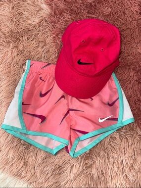 Nike Women's Pink Athletic Shorts with Teal Trim